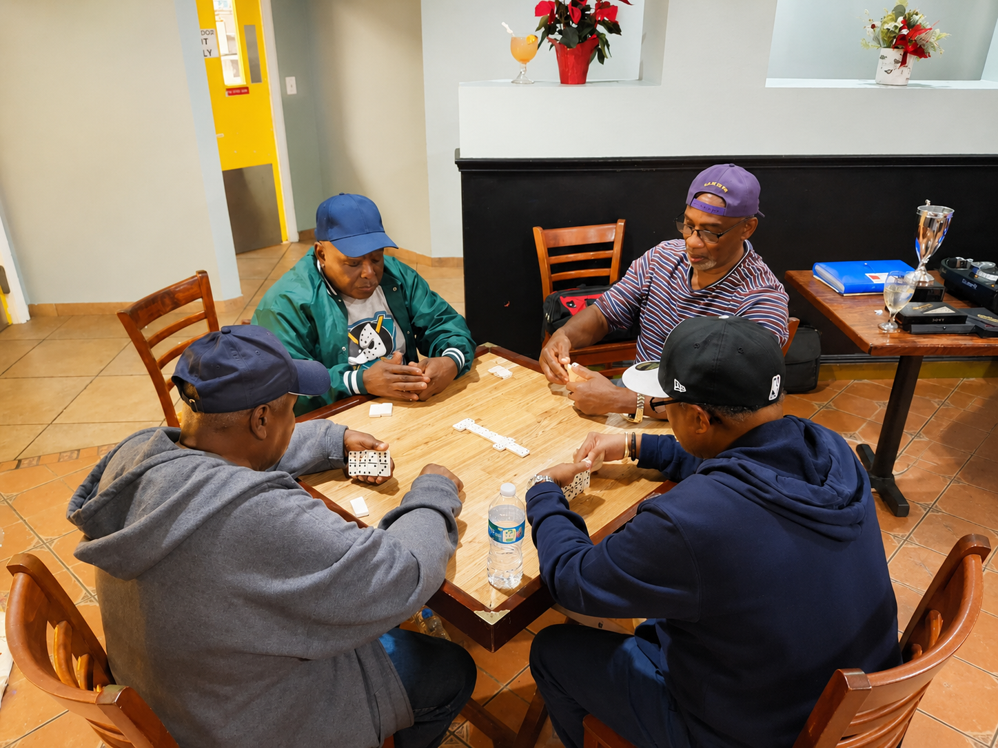Lehigh Cavaliers club members gathered around a domino table
