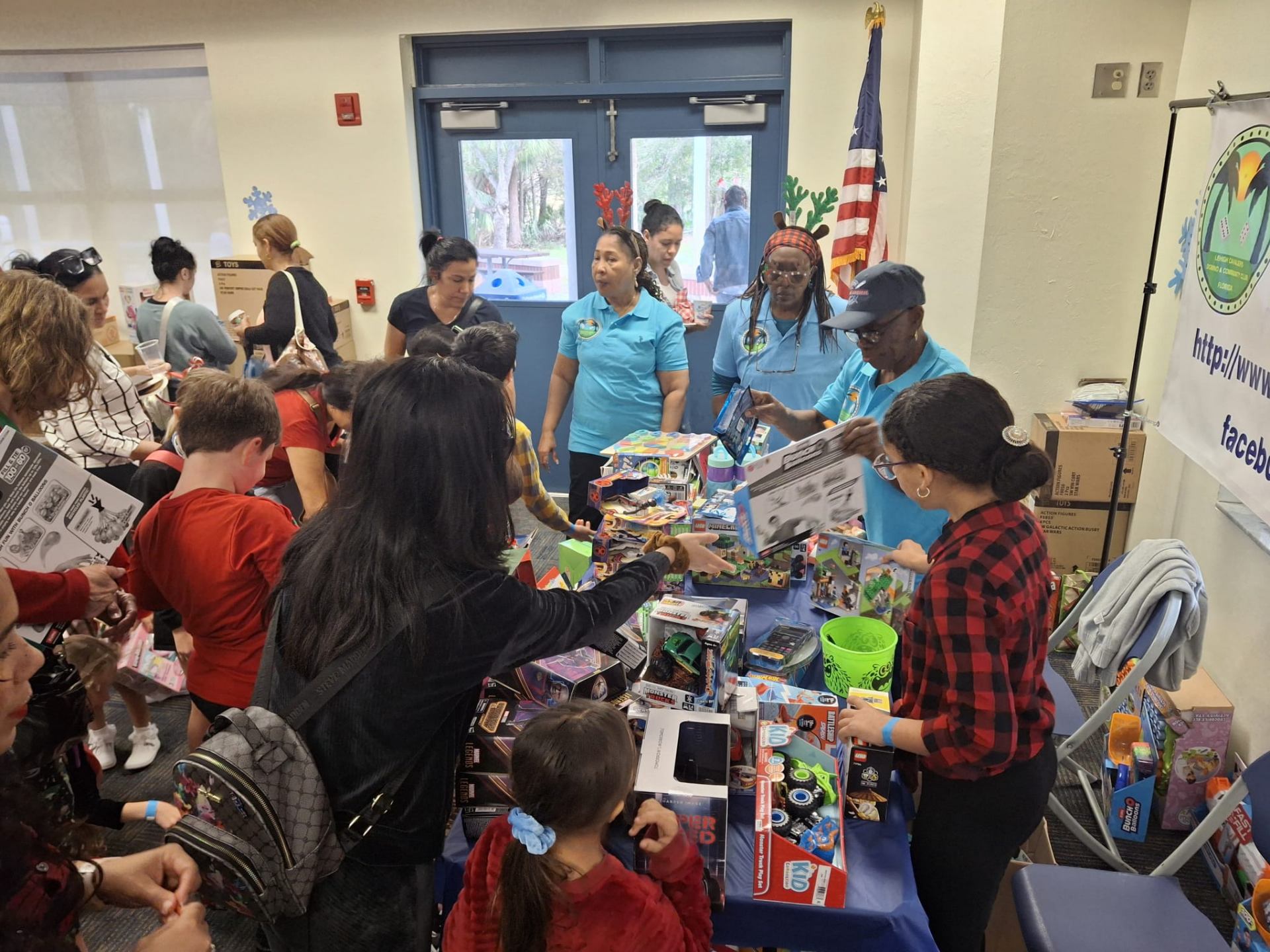 Lehigh Cavaliers volunteers handing out toys to families at the toy drive